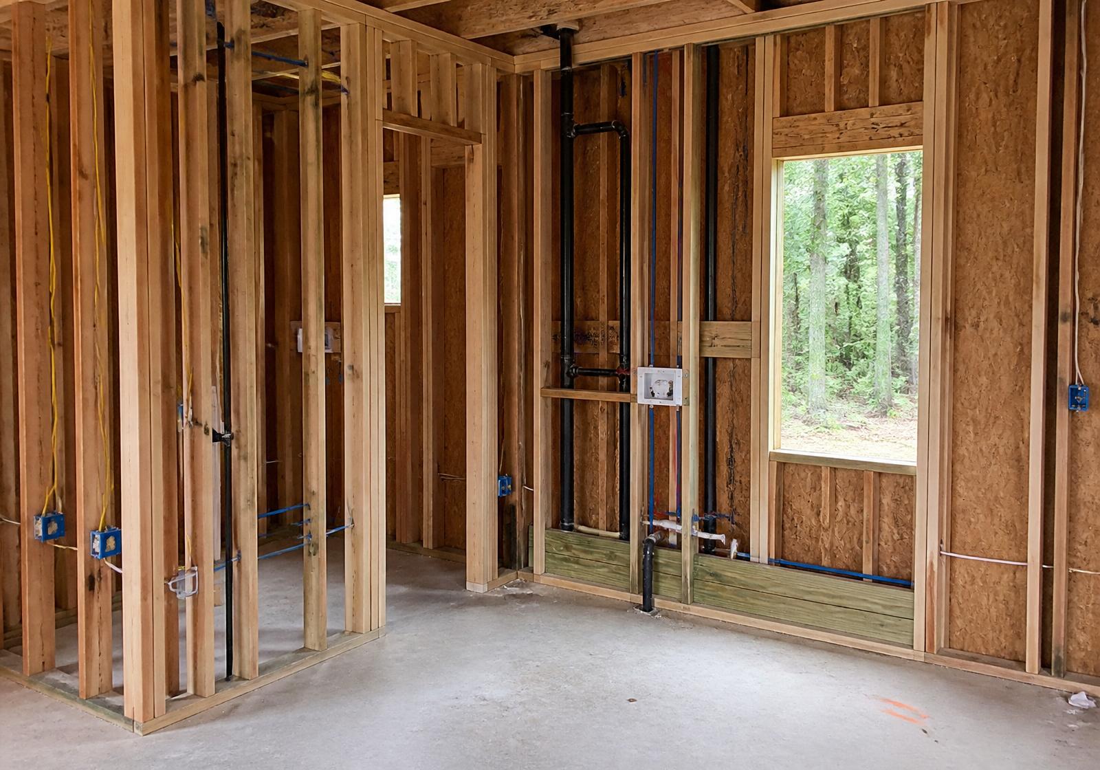 Room mid-construction: studs and rough-in